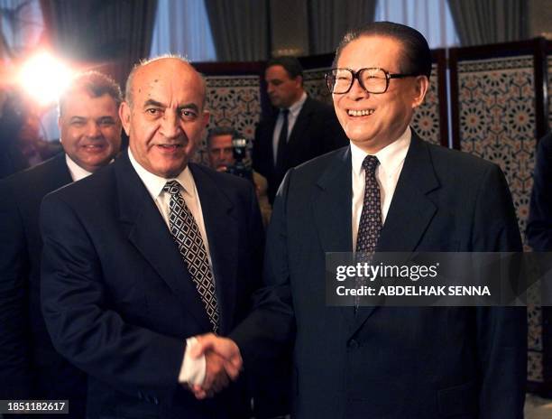 Moroccan Prime Minister Abderrahmane Youssoufi meets with Chinese President Jiang Zemin in the guesthouse of the Moroccan government 28 October 1999....