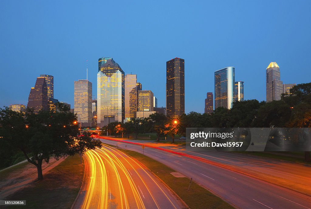 Houston skyline and light trails at dusk