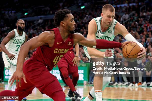Boston, MA Cleveland Cavaliers guard Donovan Mitchell steals the ball from Boston Celtics center Kristaps Porzingis during the first half at the TD...