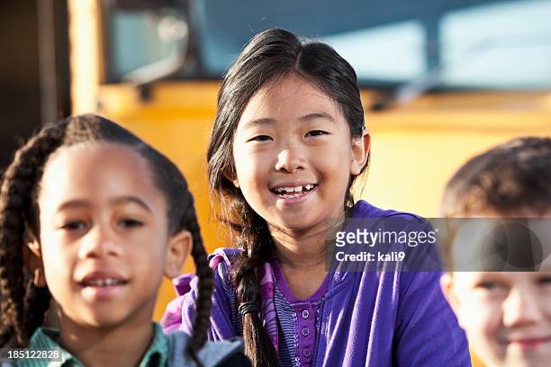 children standing outside school bus - native korean stock pictures, royalty-free photos & images