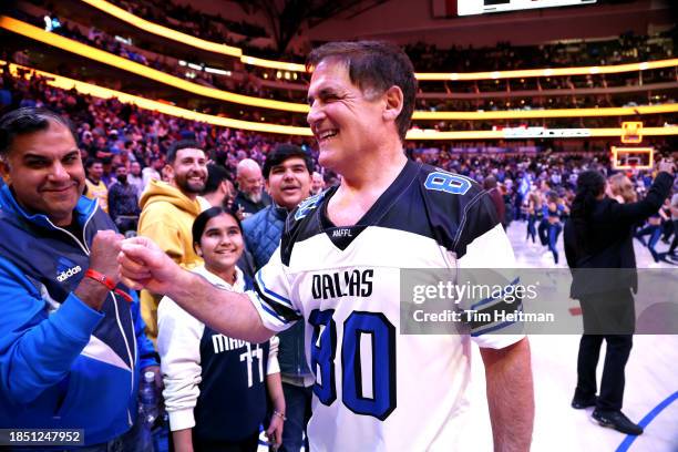 Dallas Mavericks owner Mark Cuban bumps fists with a fan after the game against the Los Angeles Lakers at American Airlines Center on December 12,...