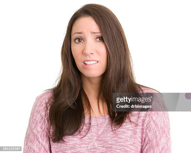 神経の若い女性 - biting lip ストックフォトと画像