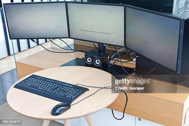 triple screen computer display game - three computer screens stock pictures, royalty-free photos & images