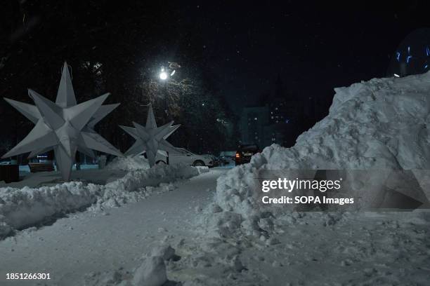 Huge white stars Christmas decorations and a giant snowdrift seen during a snowfall in Lipetsk. Lipetsk is facing an unprecedented heavy snowfall,...