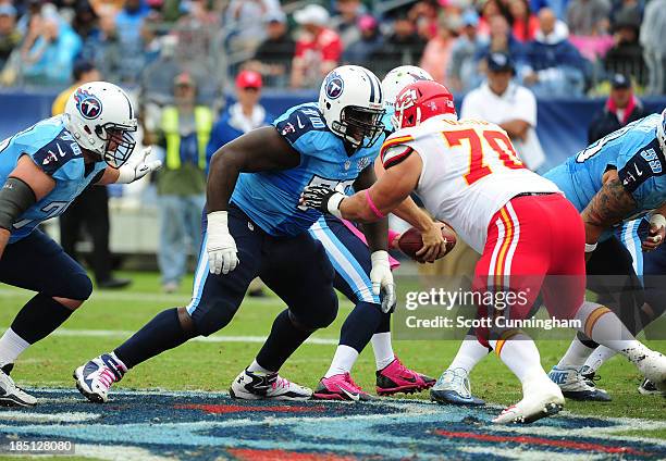 Chance Warmack of the Tennessee Titans blocks against Mike DeVito of the Kansas City Chiefs at LP Field on October 6, 2013 in Nashville, Tennessee.