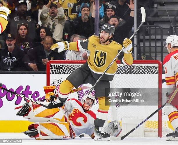 Chandler Stephenson of the Vegas Golden Knights reacts after scoring a power-play goal against Dustin Wolf of the Calgary Flames in the first period...