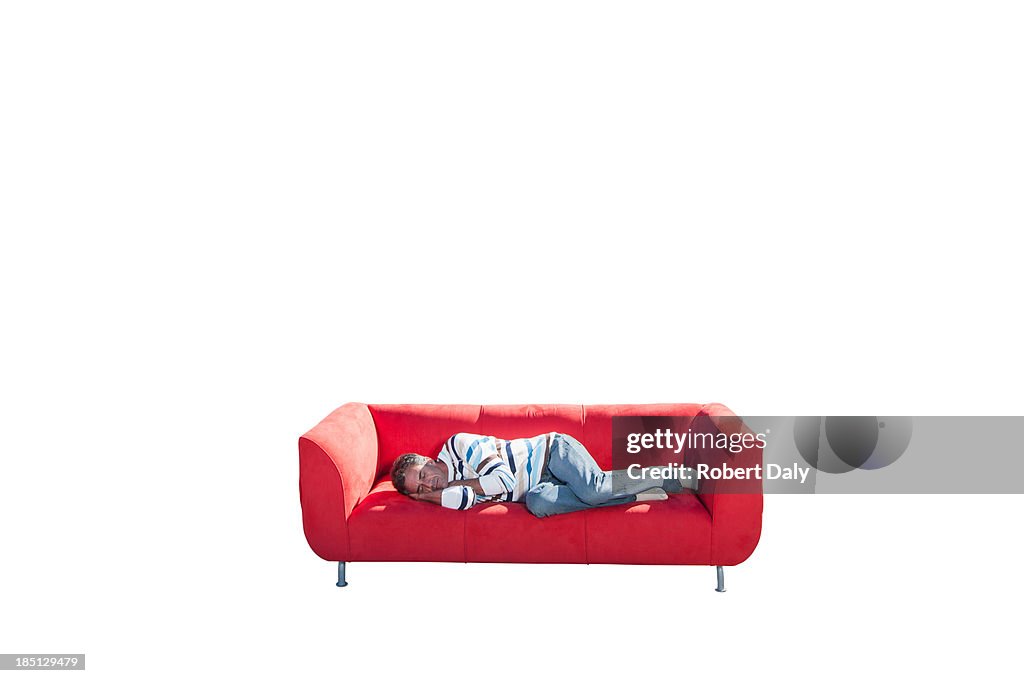 A man sleeping on a couch