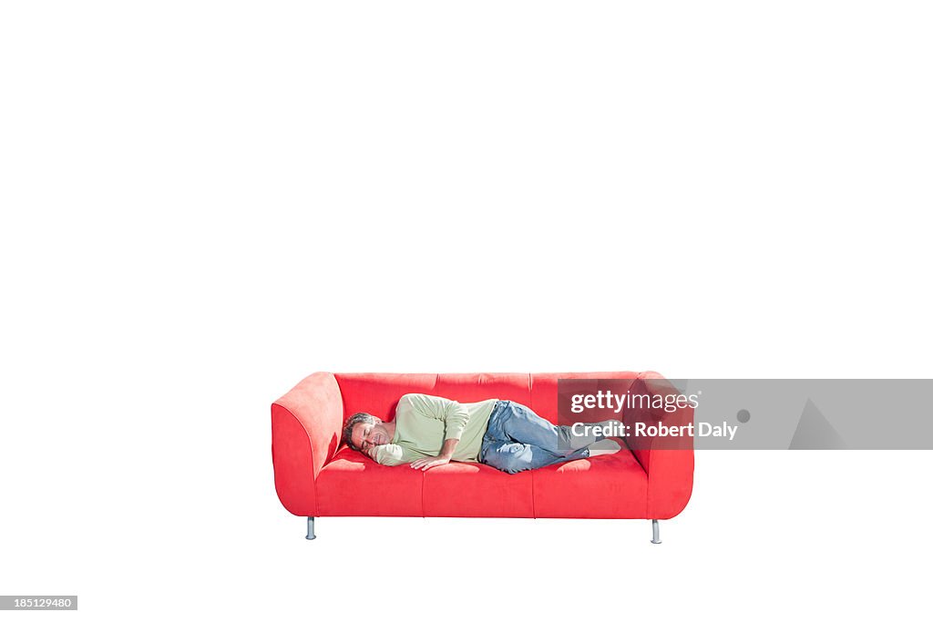 A man sleeping on a couch