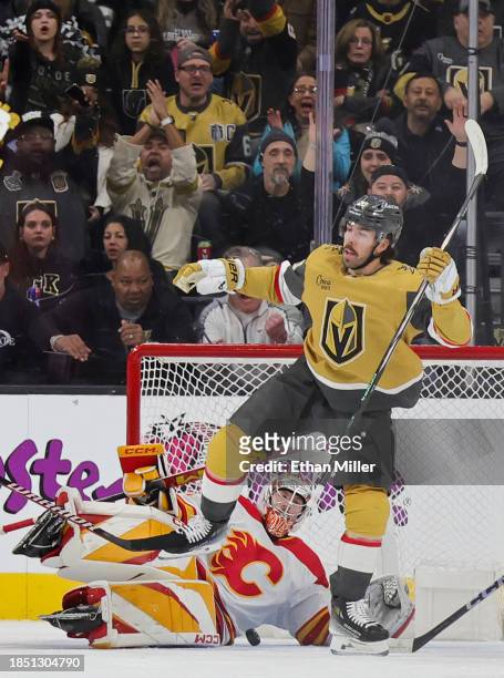 Chandler Stephenson of the Vegas Golden Knights reacts after scoring a power-play goal against Dustin Wolf of the Calgary Flames in the first period...