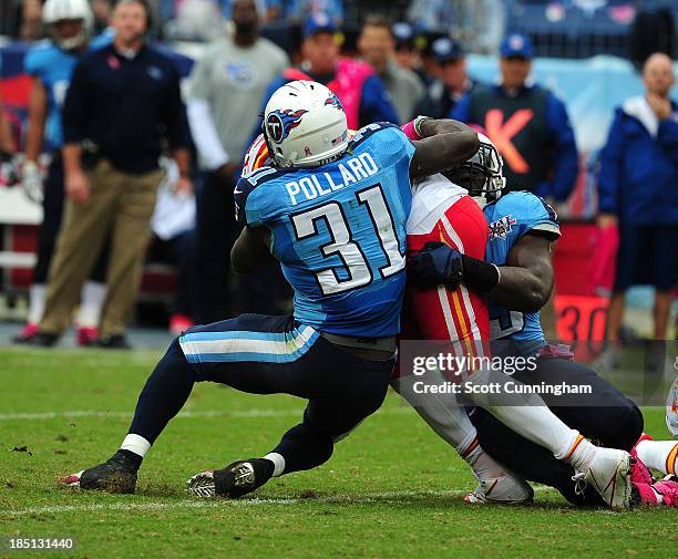 Bernard Pollard and Moise Fokou of the Tennessee Titans tackle Jamaal Charles of the Kansas City Chiefs at LP Field on October 6, 2013 in Nashville,...