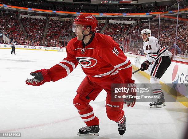 Tuomo Ruutu of the Carolina Hurricanes protests to a referee after he lost his stick on an apparent slash one of the Chicago Blackhawks during their...