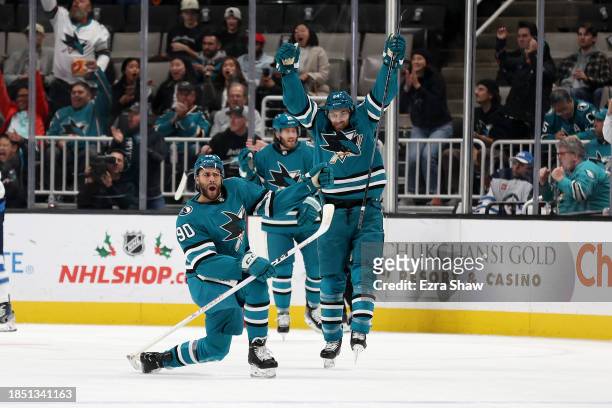 Justin Bailey of the San Jose Sharks reacts with Jan Rutta behind him after Bailey scored a goal against the Winnipeg Jets in the first period at SAP...