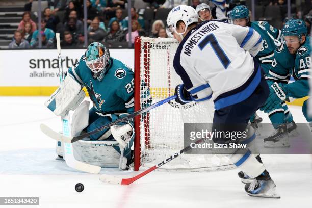 Mackenzie Blackwood of the San Jose Sharks makes a save on a shot taken by Vladislav Namestnikov of the Winnipeg Jets in the first period at SAP...