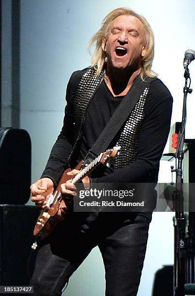 Joe Walsh of the Eagles performs at the Bridgestone Arena on October 16, 2013 in Nashville, Tennessee.