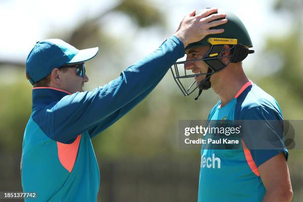 George Bailey talks with Pat Cummins during an Australian nets session at Optus Stadium on December 13, 2023 in Perth, Australia.