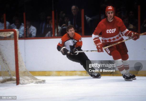 Alexei Kasatonov of the USSR skates on the ice as Bobby Clarke of the Philadelphia Flyers follows behind during the 1982-83 Super Series on January...