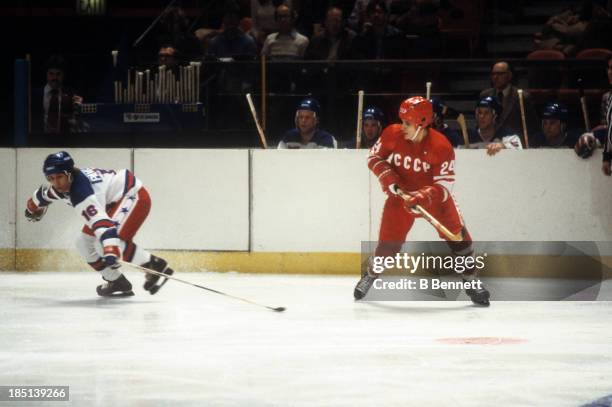 Sergei Makarov of the USSR and Mark Pavelich of Team USA go for the puck during an 1980 exhibition game on February 9, 1980 at the Madison Square...