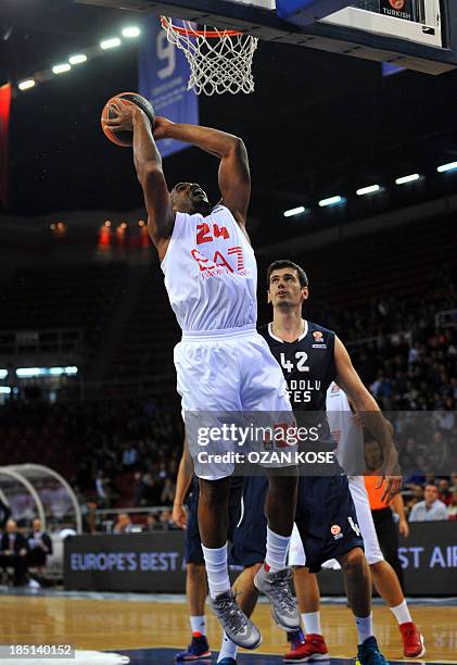 Armani Milano's Samardo Samuels vies for the ball and goes to basket with Anadolu Efes' Stanko Barac during an Euroleague basketball match between...