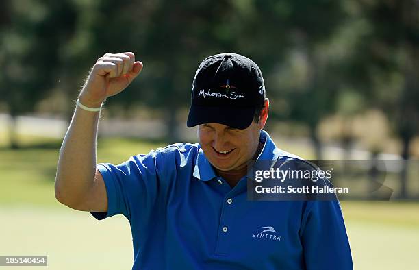 Henry waves to the gallery on the ninth green after finishing with an 11-under par 60 during the first round of the Shriners Hospitals for Children...