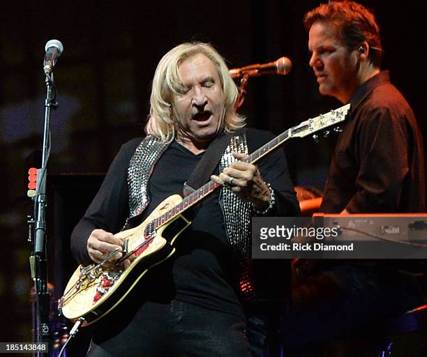Joe Walsh of the Eagles performs during "History Of The Eagles Live In Concert" at the Bridgestone Arena on October 16, 2013 in Nashville, Tennessee.