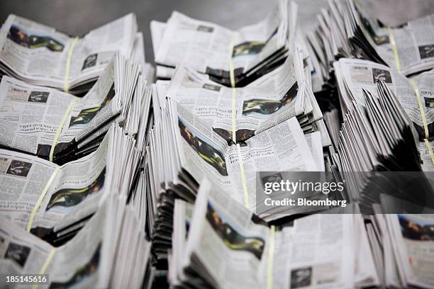 Bundles of Los Angeles Times newspapers wait to be distributed at the Olympic Press facility in Los Angeles, California, U.S, on Wednesday, Oct. 16,...