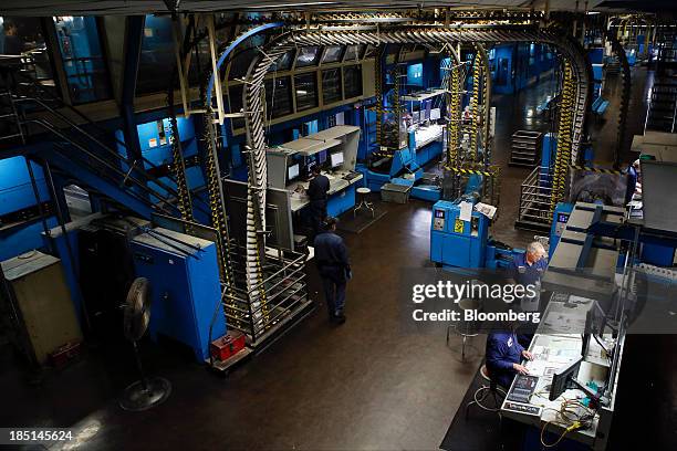 Press operators check the print quality as the Los Angeles Times newspaper is printed at the Olympic Press facility in Los Angeles, California, U.S,...