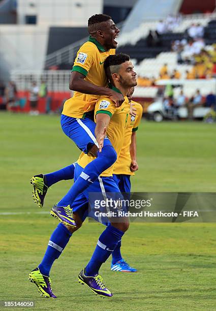 Mosquito of Brazil celebrates scoring from the penalty spot during the FIFA U-17 World Cup UAE 2013 group A match between Brazil and Slovakia at the...