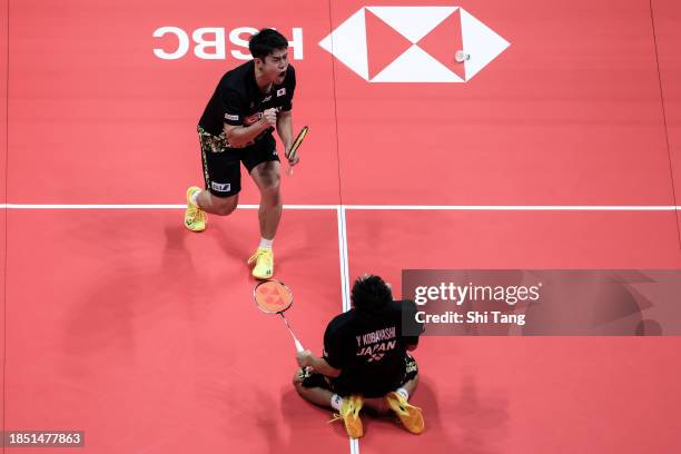 Takuro Hoki and Yugo Kobayashi of Japan celebrate the victory in the Men's Doubles Round Robin match against Aaron Chia and Soh Wooi Yik of Malaysia...