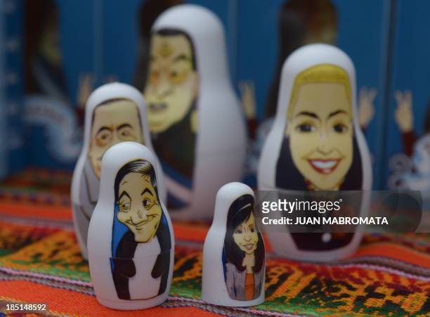 "Perushkas" with the images of peronist leaders late President Nestor Kirchner and his wife Argentine President Cristina Fernandez are on display in...