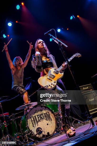 Arejay Hale and Lzzy Hale of Halestorm perform at NIA Arena on October 17, 2013 in Birmingham, England.
