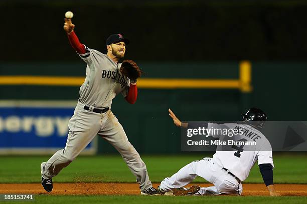 Omar Infante of the Detroit Tigers is out at second as Stephen Drew of the Boston Red Sox turns a double play on a ball hit by Brayan Pena in the...