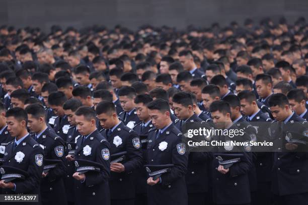 People attend the state memorial ceremony for China's National Memorial Day for Nanjing Massacre Victims at the Memorial Hall of the Victims of the...