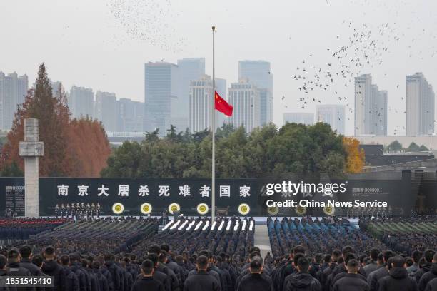 People attend the state memorial ceremony for China's National Memorial Day for Nanjing Massacre Victims at the Memorial Hall of the Victims of the...
