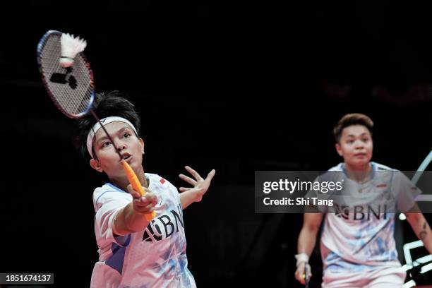 Apriyani Rahayu and Siti Fadia Silva Ramadhanti of Indonesia compete in the Women's Doubles Round Robin match against Mayu Matsumoto and Wakana...