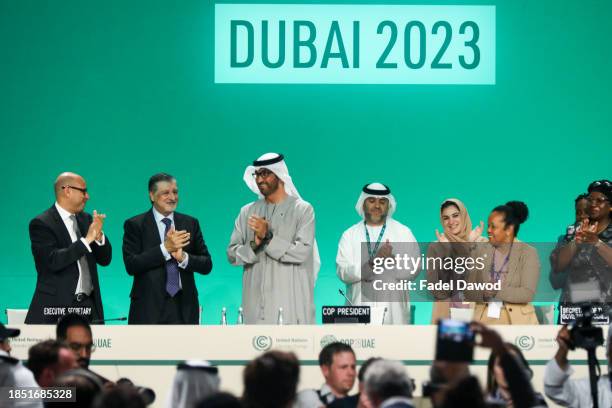 Delegates applaud after a speech by Sultan Ahmed Al Jaber , President of the UNFCCC COP28 Climate Conference, during a plenary session on day...