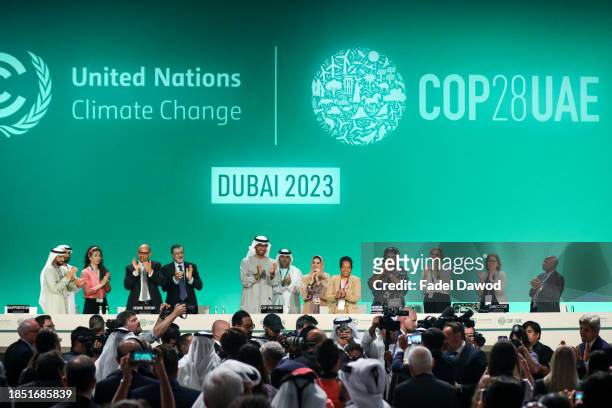 Delegates applaud after a speech by Sultan Ahmed Al Jaber , President of the UNFCCC COP28 Climate Conference, during a plenary session on day...