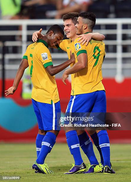 Nathan of Brazil celebrates scoring his first goal with Caio and Mosquito during the FIFA U-17 World Cup UAE 2013 group A match between Brazil and...