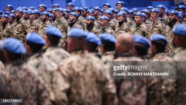 German armed forces Bundeswehr who had served under the UN mission in Mali, MINUSMA, stand still after they landed at the military air base in...