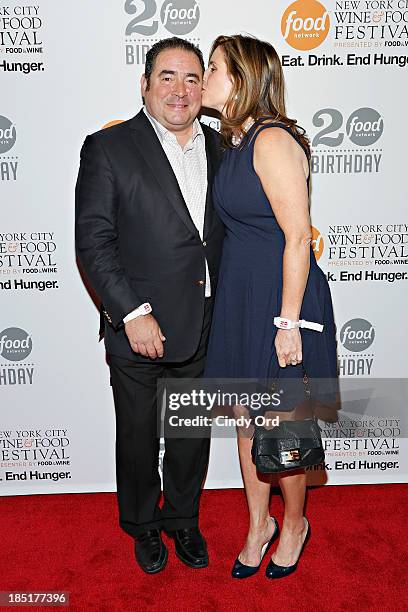 Emeril Lagasse and Alden Lovelace attend Food Networks 20th birthday celebration at Pier 92 on October 17, 2013 in New York City.