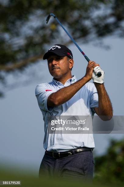 Jeev Milkha Singh of India tees off on the 14th hole during day two of the Venetian Macau Open at Macau Golf and Country Club on October 18, 2013 in...