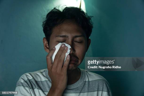young man made an ugly face while sobbing - ugly people crying stock pictures, royalty-free photos & images