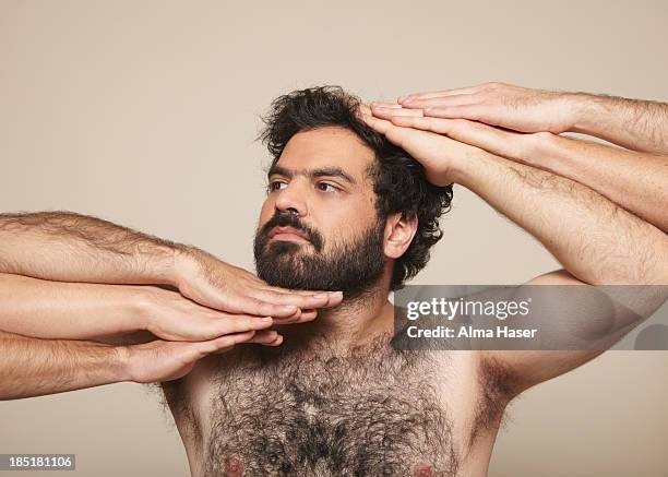 hairy man with many hands in vogue pose - cabeludo imagens e fotografias de stock