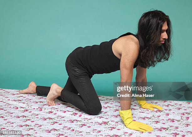 man on hand and knees with yellow rubber gloves - hairy back man stock pictures, royalty-free photos & images