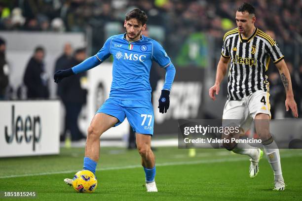 Khvicha Kvaratskhelia of SSC Napoli in action against Federico Gatti of Juventus during the Serie A TIM match between Juventus and SSC Napoli at...