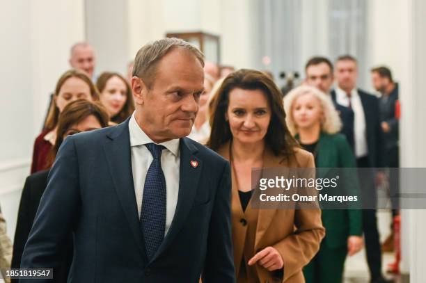 The leader of Civic Coalition and Prime Minister, Donald Tusk walks together with members of his cabinet after winning the vote of confidence at the...