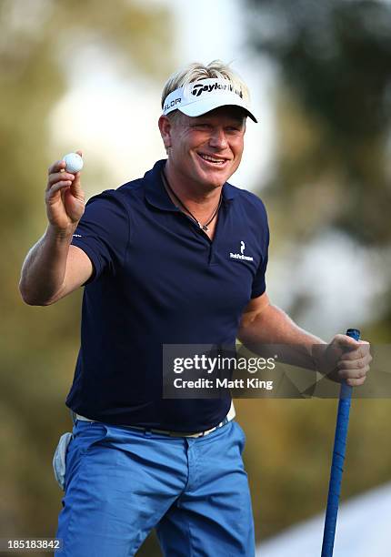 Peter Hedblom of Sweden acknowledges the crowd after finishing on the 18th hole during day two of the Perth International at Lake Karrinyup Country...