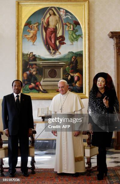 Pope Francis meets with Cameroon's President Paul Biya and his wife Chantal Biya during a private audience at the Vatican, on October 18, 2013 at the...