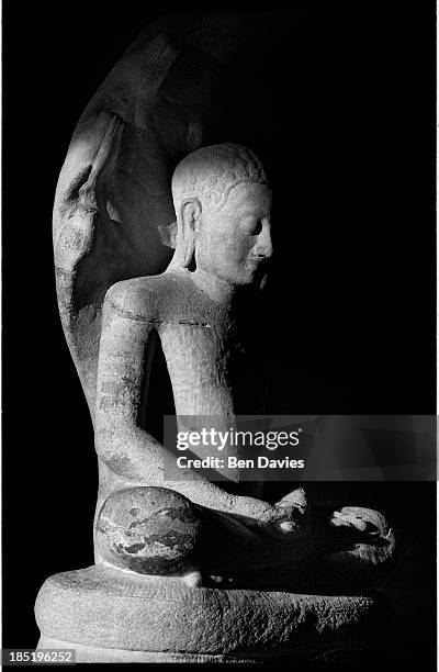 Seated Buddha statue inside Prasat Hin Phimai, an imposing stone sanctuary built by the Khmers in Thailand's Northeast. From the late 9th century,...