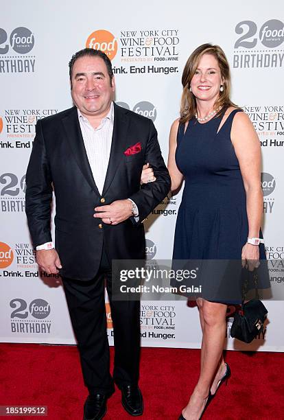 Emeril Lagasse and Alden Lovelace attend Food Network's 20th birthday celebration at Pier 92 on October 17, 2013 in New York City.