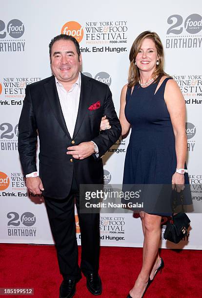 Emeril Lagasse and Alden Lovelace attend Food Network's 20th birthday celebration at Pier 92 on October 17, 2013 in New York City.